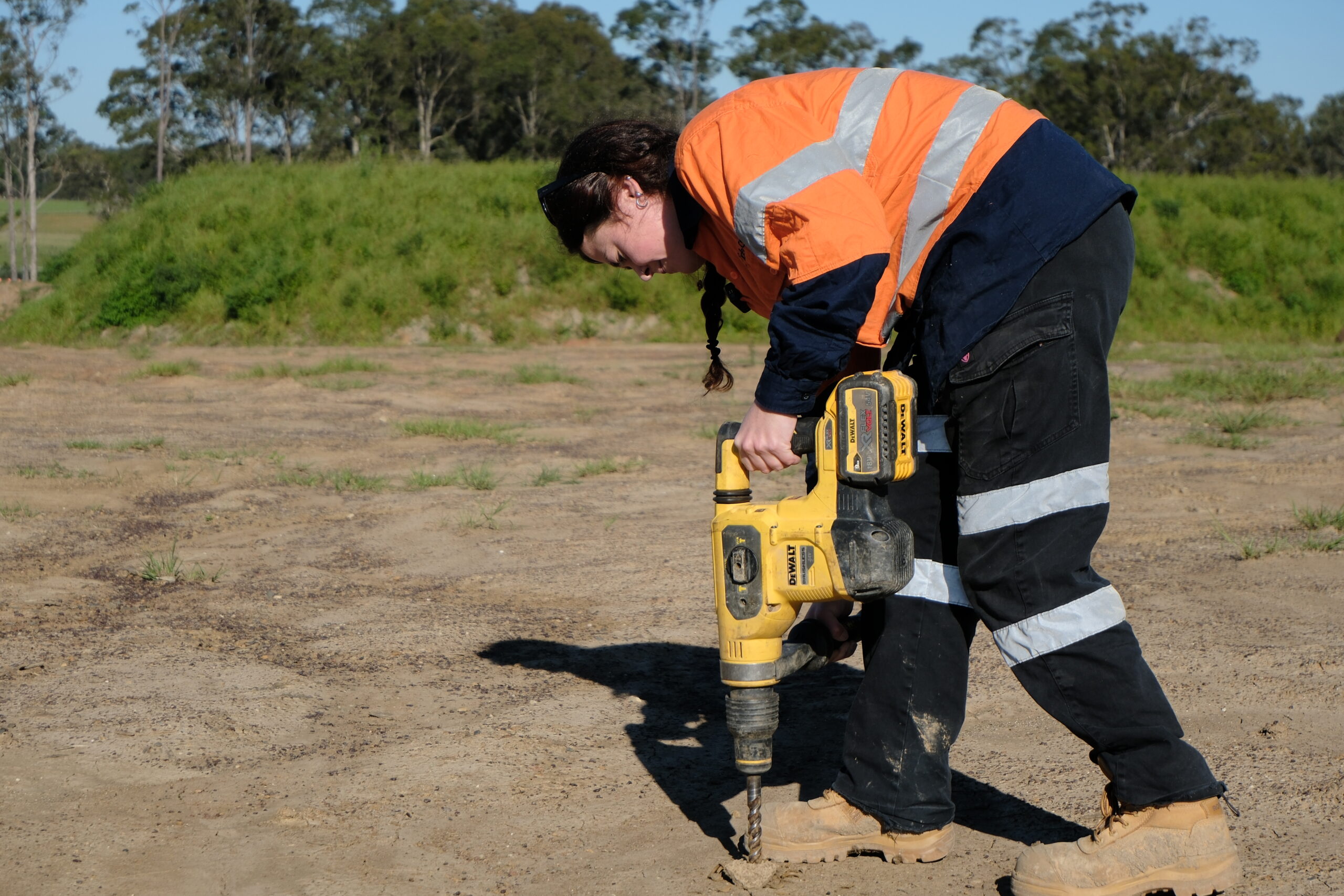 Geotechnical engineer conducting a site investigation for construction projects