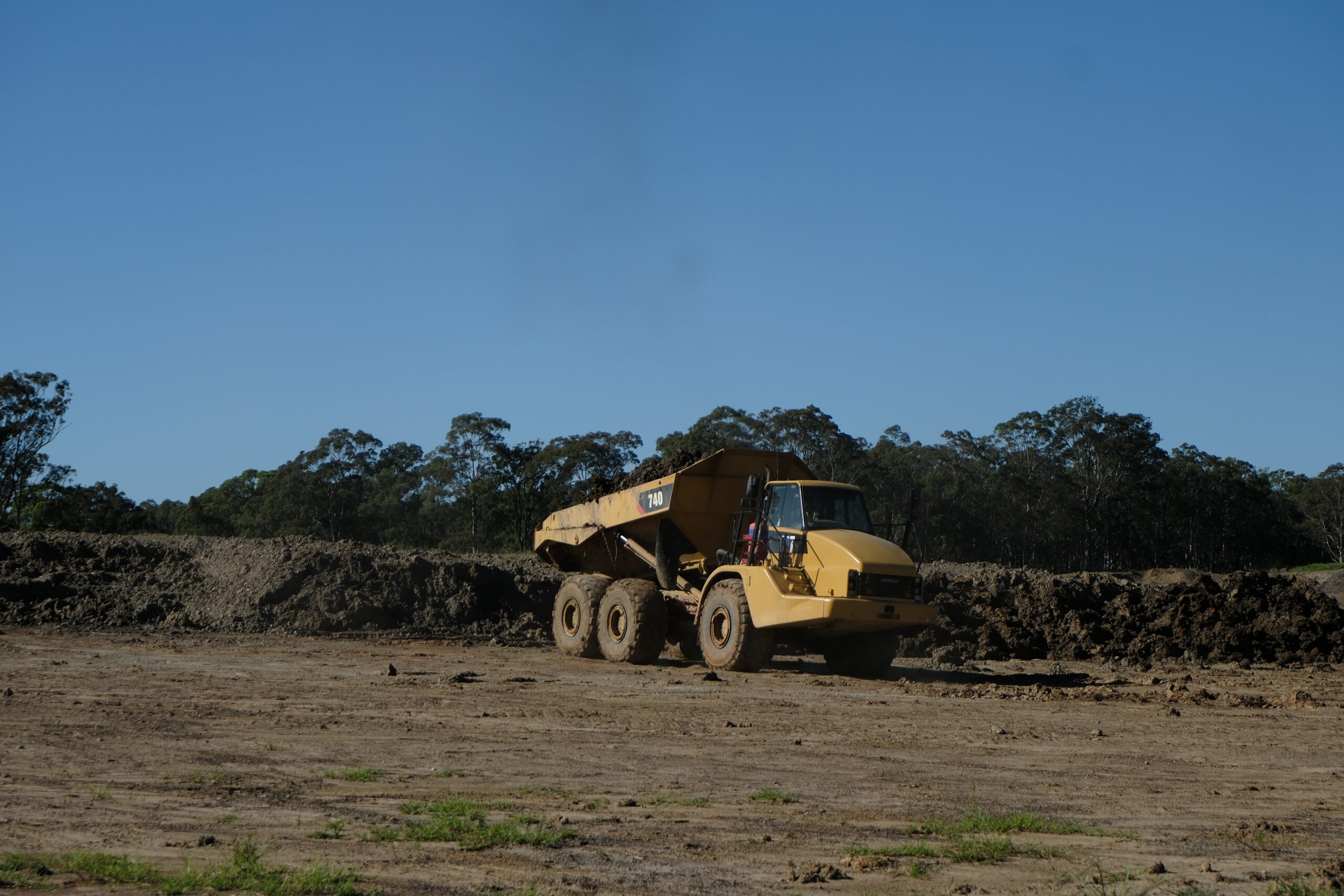 Geotechnical engineer performing earthworks testing at a construction site